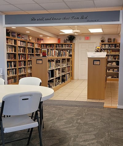 Bright library area with bookshelves and seating