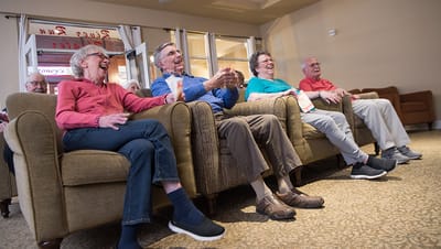 Residents enjoying a light-hearted moment in a common area