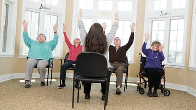 Residents participating in a seated group activity