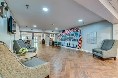 Interior view of a common area with seating and honor wall