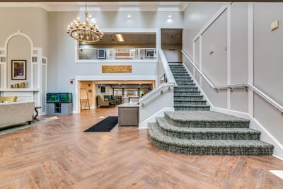 Bright lobby with stairs and seating area