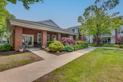 Outdoor view of the facility entrance and gardens