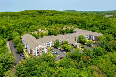 Aerial view of Solstice Senior Living at Groton surrounded by greenery