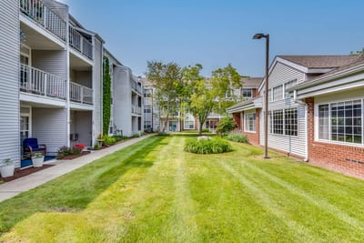 Well-maintained outdoor garden area with pathways and landscaping