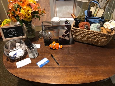 Decorative table setup with flowers and business cards