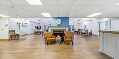 Spacious common area with seating and a fireplace