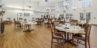 Dining area of a senior living facility with dining tables