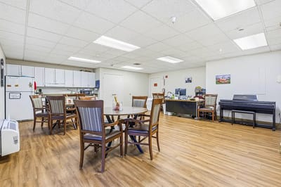 Interior view of a common area with tables and chairs