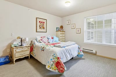 A cozy resident bedroom with floral decor