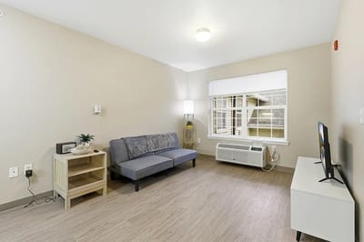 Cozy interior of a resident's room with a seating area