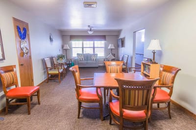 Bright common area with dining tables and chairs