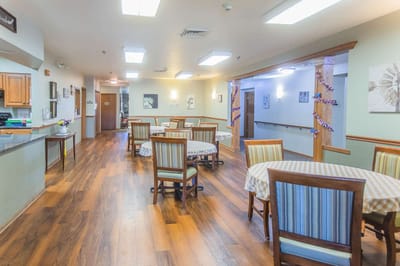 Interior view of a dining area with tables and chairs