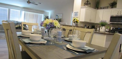 A beautifully set dining table in a modern kitchen