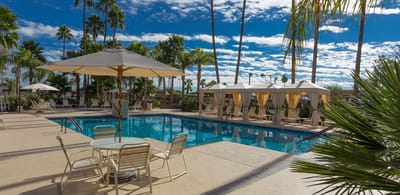 Swimming pool area with umbrellas and lounge chairs