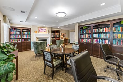 Cozy common area with bookshelves and seating