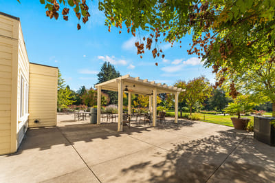 Outdoor seating area with shaded pergola and patio