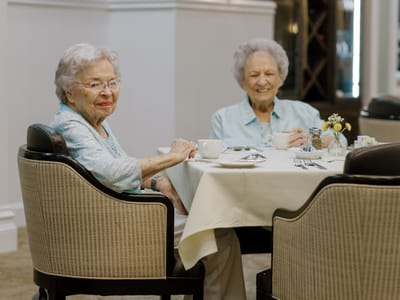 Mirador, Nursing Home in Corpus Christi, TX — Two elderly women enjoying coffee at a dining table