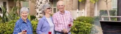 Mirador, Nursing Home in Corpus Christi, TX — Seniors enjoying a barbecue in a garden setting