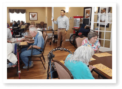 Residents engaged in a bingo game activity.