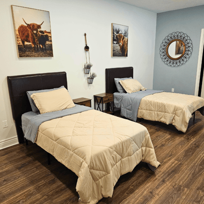 Two twin beds in a cozy resident room.