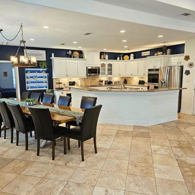 Spacious facility common area with a dining table.