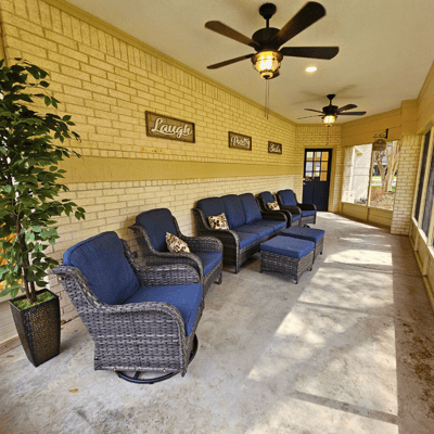 Cozy common area with wicker seating and decor