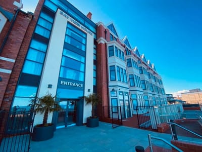 Building exterior with entrance and outdoor area.