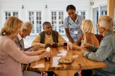 Residents engaging with staff in a common area