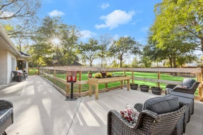 Patio area with seating and flower arrangements