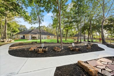Outdoor pathway and landscaped area at the facility