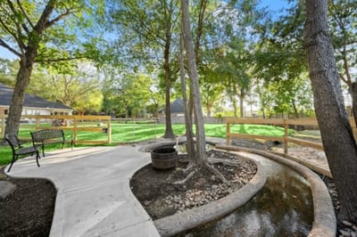 Peaceful outdoor space with seating and greenery.