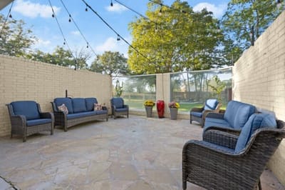 Cozy outdoor seating area with plants.