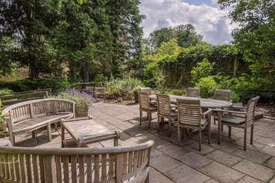 Outdoor seating area with tables and chairs