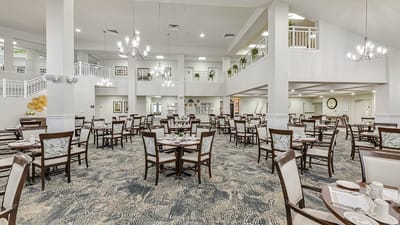 Spacious dining area with tables and chairs.