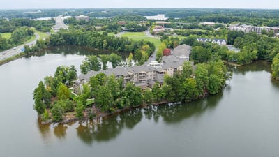 Aerial view of a nursing home surrounded by water.