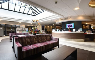 Bright lobby area with reception and seating