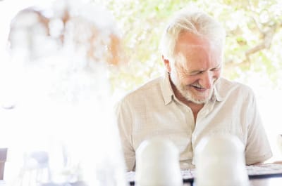 Smiling elderly man enjoying time outdoors