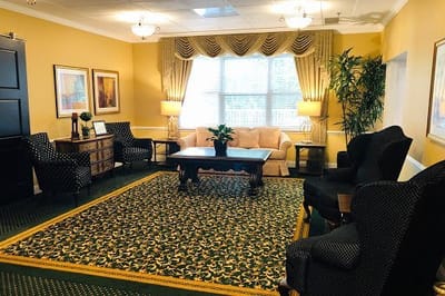 Cozy common area with seating and plants.