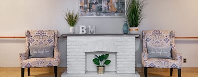 Comfortable seating area with decorative plants.