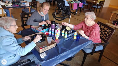 Residents engaging in an art activity together.