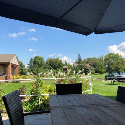 Outdoor patio with seating and greenery