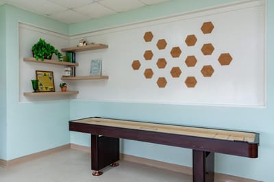 Interior space with a shuffleboard table and decor