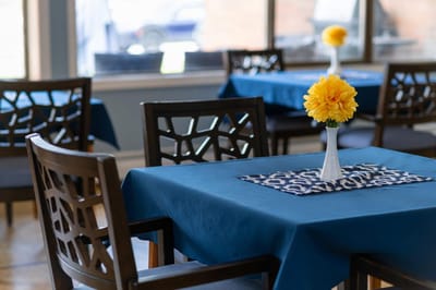 Dining area with tables and flowers
