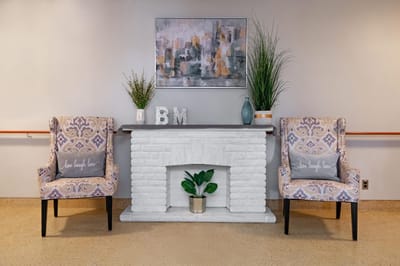 Cozy lounge area with decorative chairs and artwork