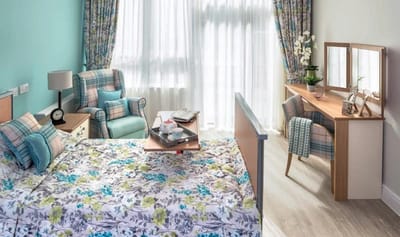 Comfortable resident room with natural light.