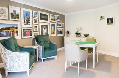 Cozy common area with seating and artwork.