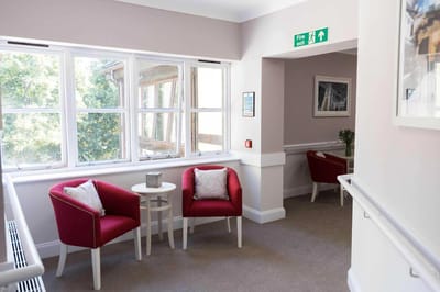 Interior common area with seating and natural light.
