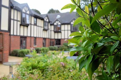 Exterior view of a garden area and building.