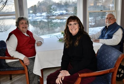 Three residents enjoying time together indoors