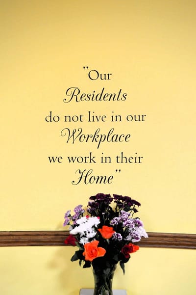 Wall quote highlighting resident care philosophy